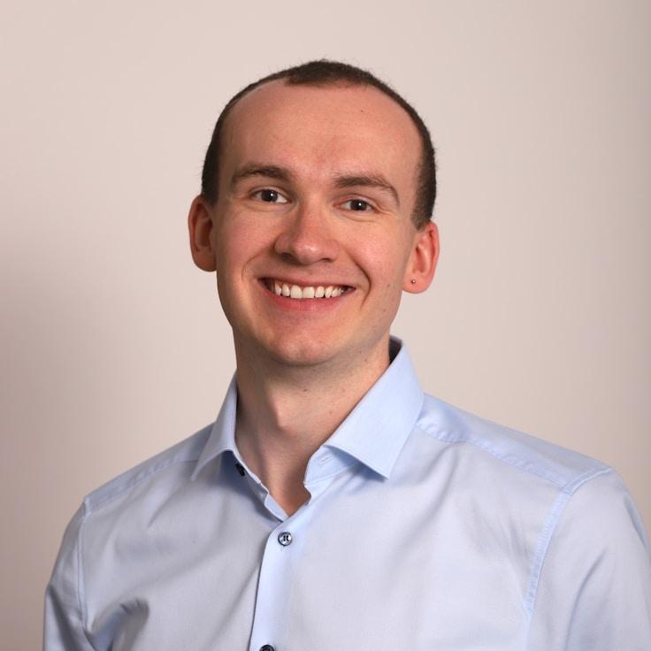 Kaveri Mehta, Lead Design Curator at GrassRootStudio, reviewing corporate floral arrangements